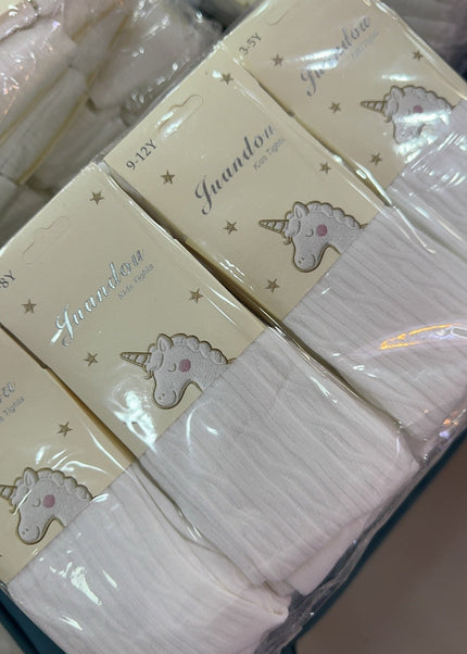 White baby girl stockings in Juandon unicorn packaging, available in sizes 1–12 years