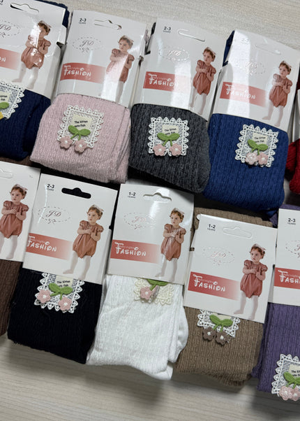 Girls textured cotton tights in multiple colors including navy, pink, charcoal, red, white, purple and more with lace floral badge detail